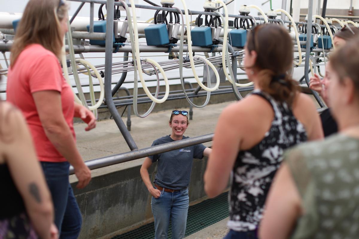 A trip to Shelburne Farms Dairy includes a tour of the milking parlor with Mo Whitney, Assistant Herdsman and Calf Manager. Photo by Holly Brough. A trip to Shelburne Farms Dairy includes a tour of the milking parlor with Mo Whitney, Assistant Herdsman and Calf Manager. Photo by Holly Brough.