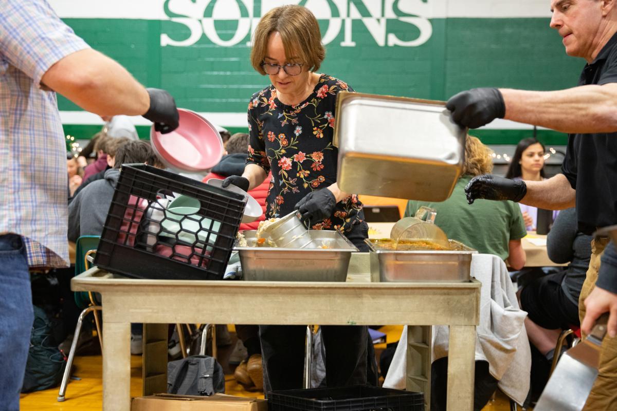 Teachers serve soup from a cart Teachers serve soup from a cart