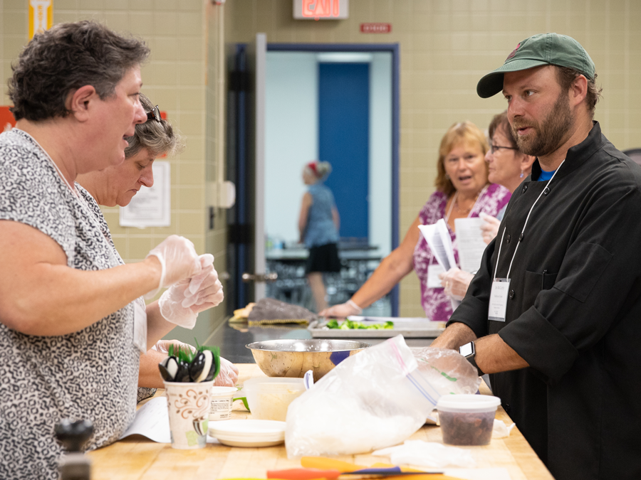 Chef Jim cooking with workshop participants. Chef Jim cooking with workshop participants.