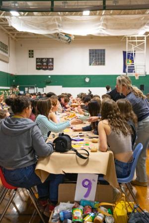 The Montpelier Solon Soup for the Soul event. Students are seated at long tables in the gym, as they eat. The Montpelier Solon Soup for the Soul event. Students are seated at long tables in the gym, as they eat.